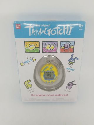 Tamagotchi Yellow / Blue Electronic Virtual Reality Pet 1.  5 " Bandai Gen 2