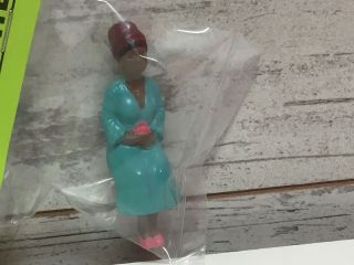 G Scale Figure - Woman Sitting With Blue Dress Holding A Pink Flower