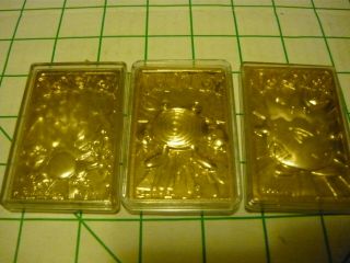 3 1999 Pokemon Special Edition Gold Plated Cards.  Togepi,  Poliwhirl,  Charizard