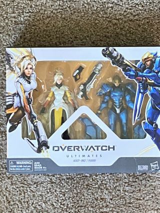 Overwatch Ultimates Series Pharah And Mercy 2 Pack Must Go See Box,  Description
