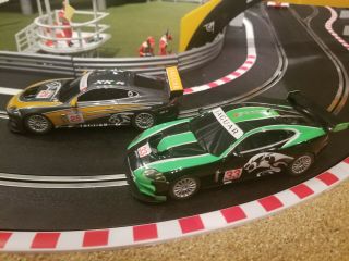 Scalextric 1/32 slot cars 2 x Jaguar XKR GT3 1 in green and 1 in orange 2