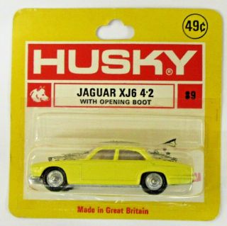 Husky 89 Jaguar Xj6 4.  2 Yellow With Red Interior On Small Card Diecast Dc
