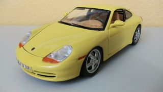 Burago 1997 Porsche 911 Carrera Yellow Diecast Car 1/18 Scale