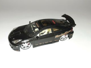 Toyota Celica Black Jada Toys Import Racer 63184 1/18 Scale Diecast Car