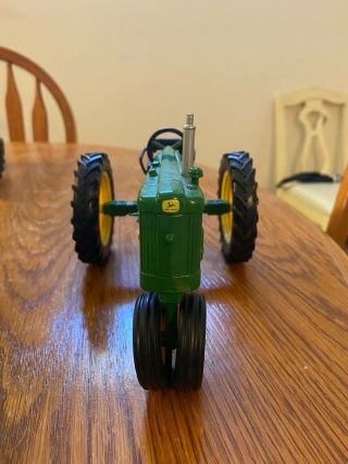 green 1:16 John Deere 420 toy tractor,  out of box,  dimensions 7x5x2.  5 2