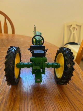 green 1:16 John Deere 420 toy tractor,  out of box,  dimensions 7x5x2.  5 3