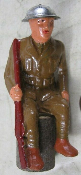 Vintage Barclay Manoil Soldier Sitting On Stump With Rifle At Side Metal Hat