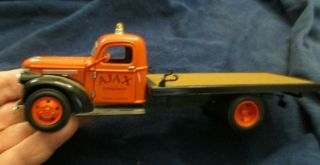 Near 1/43 Die Cast National Motor Museum 1941 Chevy Flat Bed Ajax Towing