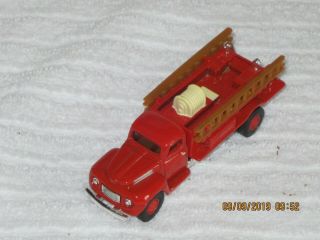 Golden 1940s Red Ford Pumper Fire Truck