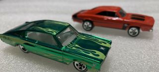 Loose Hot Wheels Dodge Chargers.  1 Red ‘69 R/t,  1 Metallic Green ‘67.