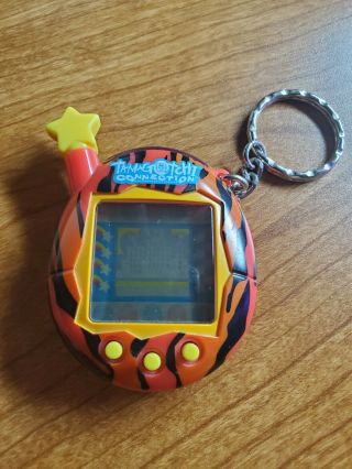 Tamagotchi Connection Red Tiger Stripes Fire Star 2004 Bandai,  Battery