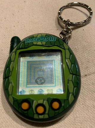2004 Bandai Wiz Tamagotchi Connection Version 3 - Green Reptile Scales Theme