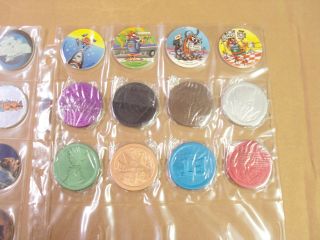 UNIVERSAL STUDIOS MCDONALDS COMPLETE SET of ALL 24 POGS,  8 SLAMMERS in POG PAGE 2