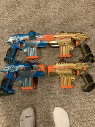 Four Nerf Phoenix Ltx Laser Tag System.  2 Blue 2 Gold Blasters