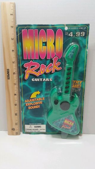 Vintage Micro Rock Guitars Toy