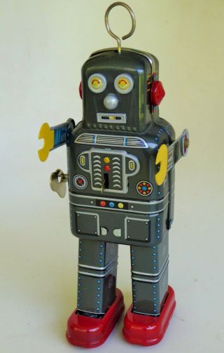Price Drop Atomic E Robot Tin Lithographed Mechanical Sparking Toy 8.  75 " Tall