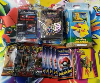 Pokemon Mystery Box Includes 10 Booster Packs,  1 Mini Binder,  1 Theme Deck,  More