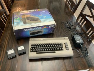 Commodore 64k Computer With Power Supply And Games - Powers On.