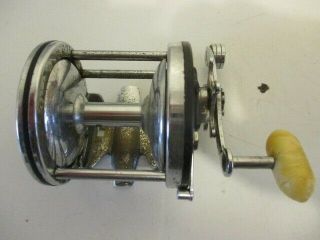 Vintage Penn No.  99 Silver Beach Fishing Reel Chrome And Black With White Handle