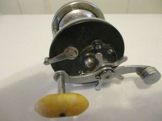 Vintage Penn No.  99 Silver Beach Fishing reel Chrome and Black with White handle 2