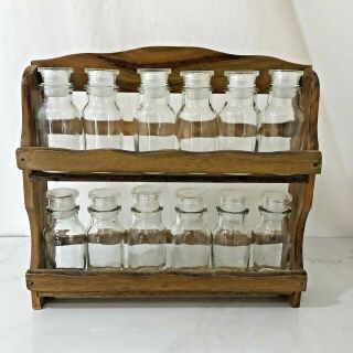Vintage Wood Spice Rack Wall Hanging And 12 Glass Bottles Jars Lids Tops