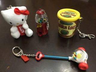 4 Vintage Mini Toy Keychains Hello Kitty,  Lincoln Logs,  Gumball Machine Popper Toy