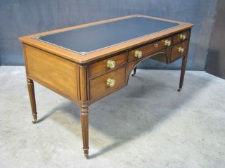 A Kittinger Regency Style Mahogany Writing Desk With Black Leather Top