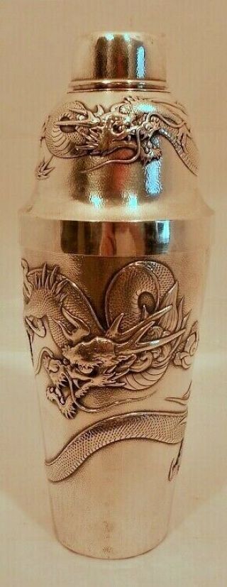 A Chinese Export Sterling Cocktail Shaker,  Repousse Dragons,  Sun,  Signed.