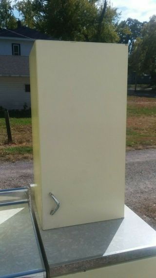 Vintage Yellow Youngstown metal kitchen cabinets.  Yellow sink in 4