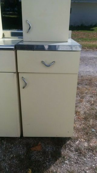 Vintage Yellow Youngstown metal kitchen cabinets.  Yellow sink in 5