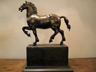 A bronze figure of a prancing horse after the antique 3