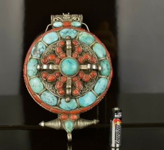 A Large And Heavy Tibetan Silver Pendant With Coral And Turquoise