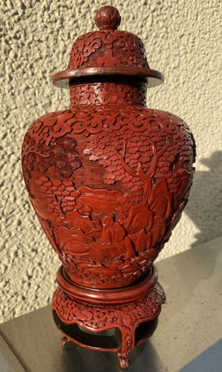 A Large 19th Century Chinese Carved Lacquer Jar And Cover And Stand