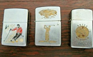 Qty 3 Vintage Zippo Lighters - Skiing Skier,  Golfing And Zodiac Aries