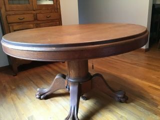 48” Round Tiger Oak Table W/clawfeet Comes With 1 Leaf.  Circa 1920’s