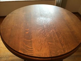 48” Round Tiger Oak Table w/clawfeet comes with 1 leaf.  Circa 1920’s 2