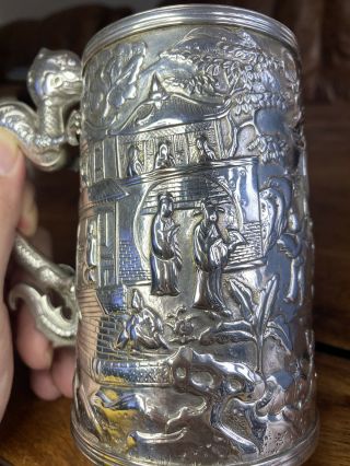 A large quality 19th century Chinese carved silver mug 4