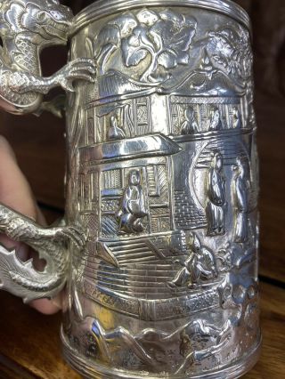 A large quality 19th century Chinese carved silver mug 6