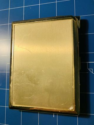 Benson & Hedges 100,  Gold Tone Cigarette Case With Built In Lighter.
