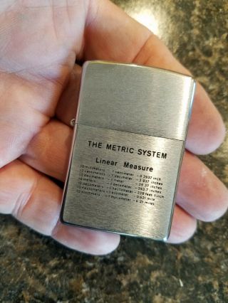 1977 Zippo Cigarette Lighter,  Metric System Linear One Side,  Weights Other