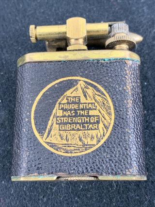 Vintage Unmarked Brass Lift Arm Pocket Lighter With Leather Wrap Adv.  Prudential