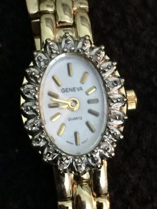 Geneva Ladies Quartz Wrist Watch,  Oval Case Diamond Bezel Gold Plated,  White Face