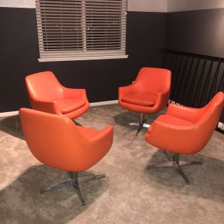 Mid Century Modern Orange Swivel Lounge Chairs (set).  1960s.  Middletown Mfg Co.