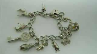 Vintage Sterling Silver Charm Bracelet With 11 Charms - 33 Gms