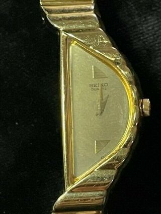 Ladies Vintage Seiko 1F20 - 5D59 Gold Tone Stainless Half Moon Asymmetrical Watch 2