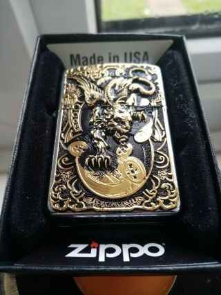 Vintage Golden devil zippo dated X comes with none matching unfired insert XIII 2