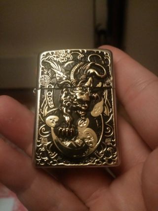 Golden devil dragon zippo dated 2007 comes with 2006 inserr NO BOX 2