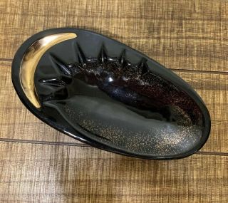 Vintage Mid Century Modern Oval Black And Gold Footed Ashtray.