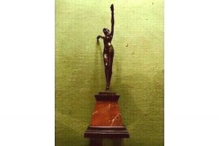 Art Deco Style Bronze Dancing Lady Arms Aloft Figure On A Marble Base.