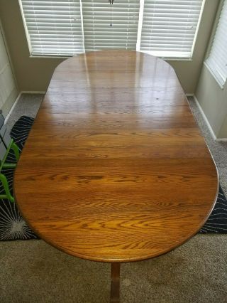 Solid Oak Dining Room Table With Six Chairs Four Extension Leaves.  Length 4 - 8 Ft